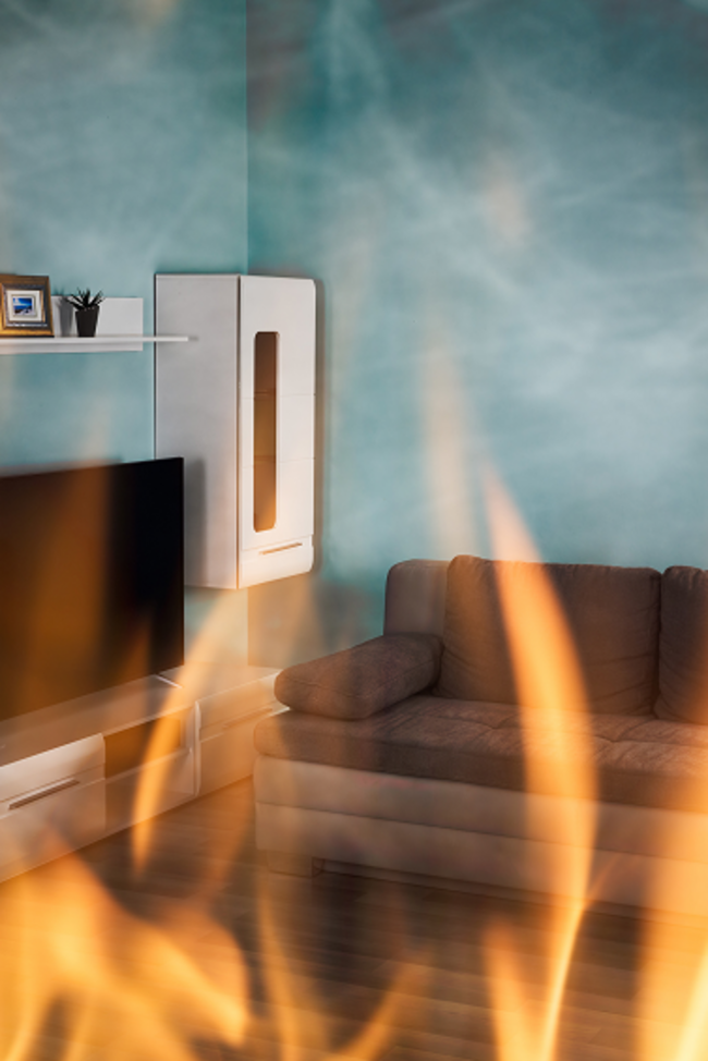 Symbolbild Blogbeitrag vermietete Wohnungen. Bild zeigt Brand in einem Wohnzimmer