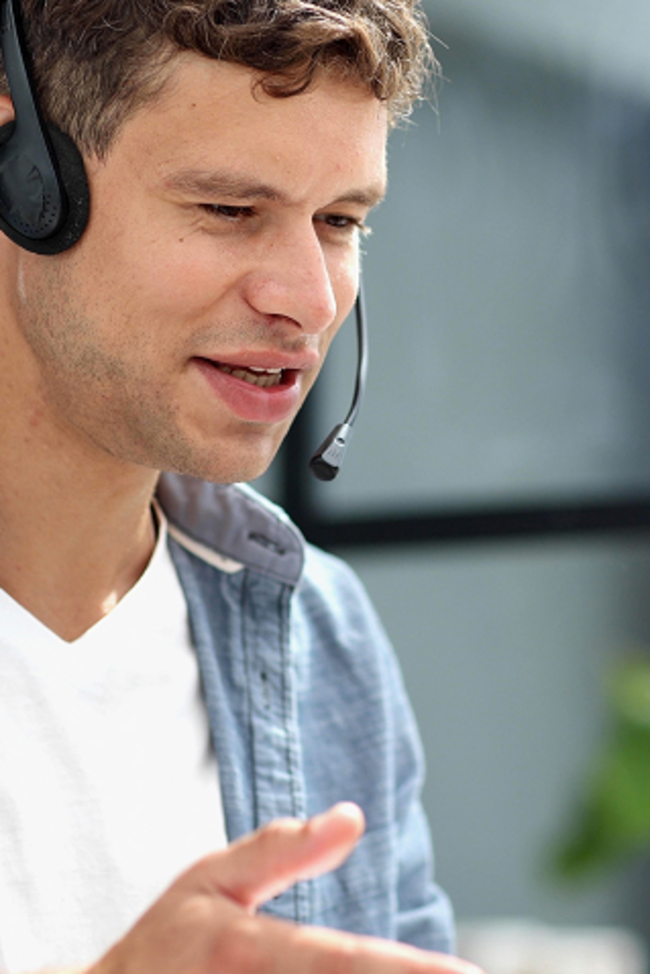 Business-Mann mit Telefon-Headset